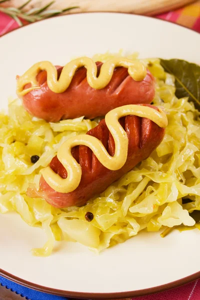 Sauerkraut, sour cabbage with sausage, traditional german meal — Stock Photo, Image