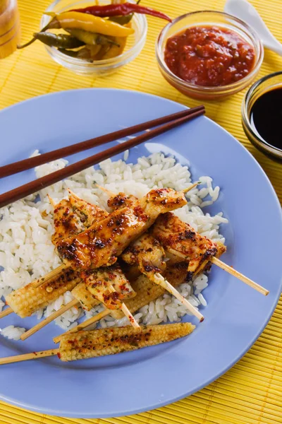 Asian style chicken skewer with baby corn and rice — Stock Photo, Image