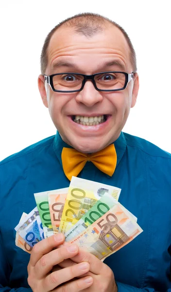 Smiling man holding handful of money — Stock Photo, Image