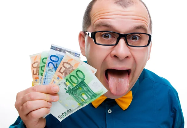Avuç dolusu para ile mutlu bir adam — Stok fotoğraf