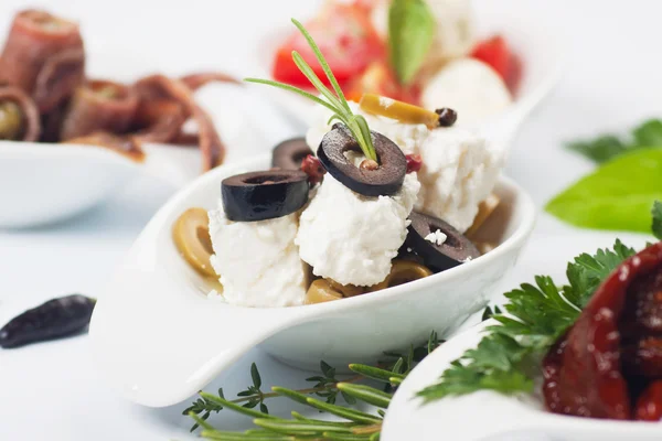 Cheese appetizer with olives and rosemary — Stock Photo, Image
