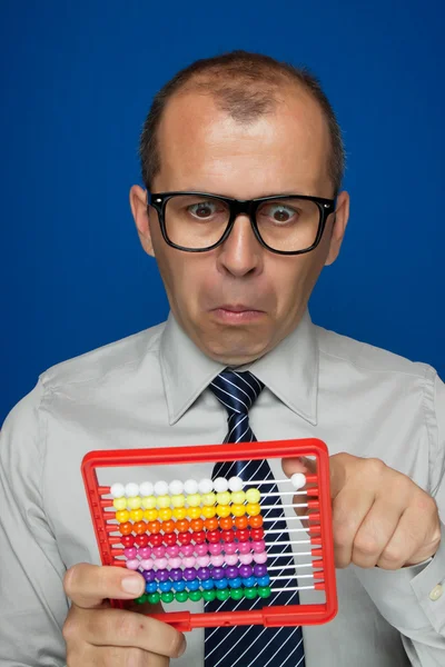 Man with abacus calculator — Stock Photo, Image