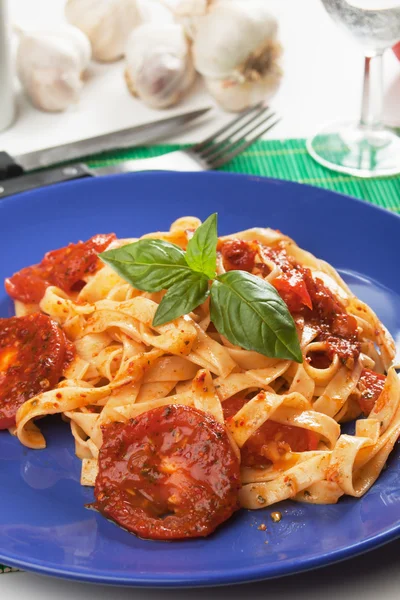 Pasta milanese with basil and tomato — Stock Photo, Image
