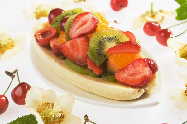 Split banana with fresh fruit — Stock Photo, Image