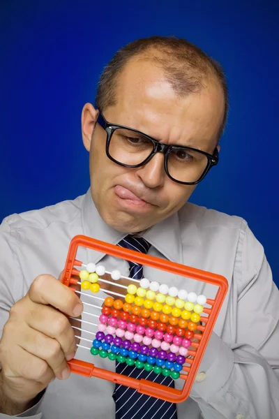 Man with abacus calculator — Stock Photo, Image