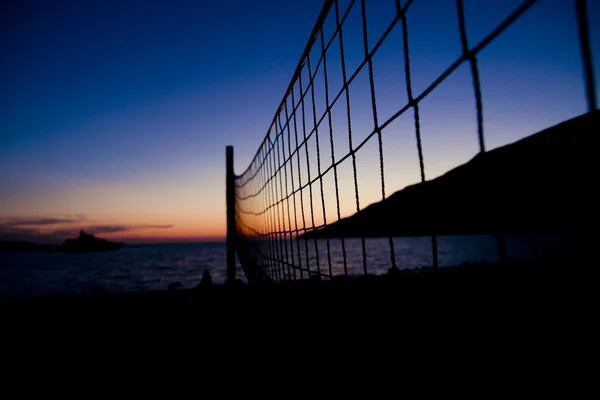 Volleyballnetz bei Sonnenuntergang Stockfoto