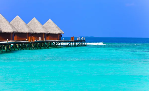 Island in ocean, overwater villas — Stock Photo, Image