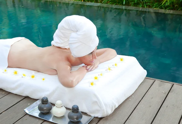 The young beautiful woman on Spa procedures in pool — Stock Photo, Image