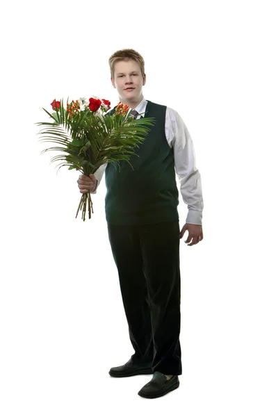L'élève en uniforme scolaire avec un bouquet de fleurs — Photo