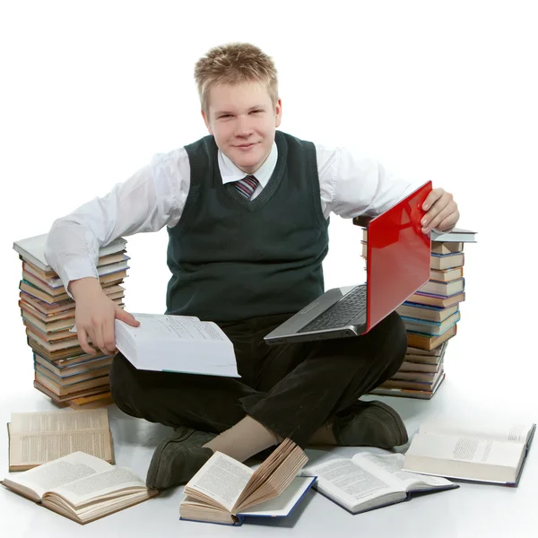 L'adolescent avec un tas de manuels scolaires . — Photo