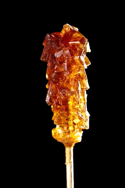 Bonbonbrauner Zucker auf einem Stock — Stockfoto