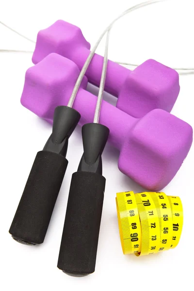 Skipping rope, measuring tape and and Pink dumbbells in a neoprene cover — Stock Photo, Image