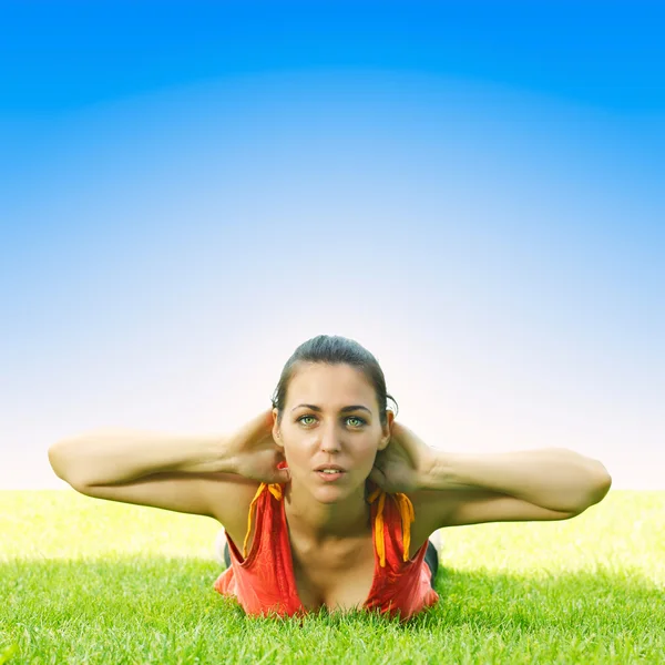 Active young women doing stretching exercise outdoors — Stock Photo, Image
