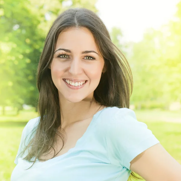 Happiness young woman in park — Stock Photo, Image
