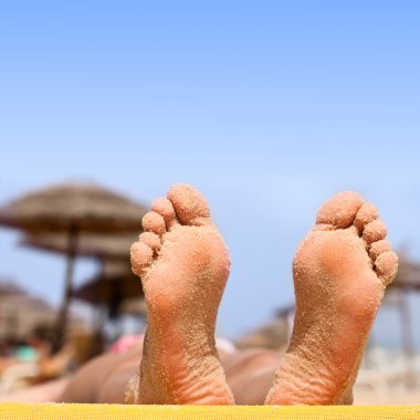 Sandy feet on the beach clipart