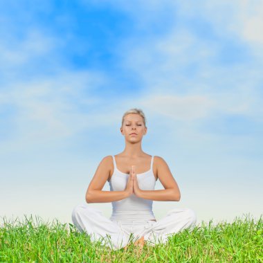 Yoga woman meditating outdoors clipart