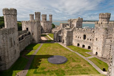 Caernarfon castle in Snowdonia, Wales clipart