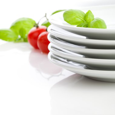 White plates on the table clipart