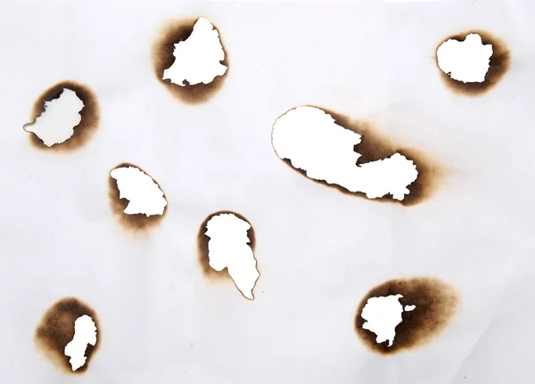 Burnt holes — Stock Photo, Image