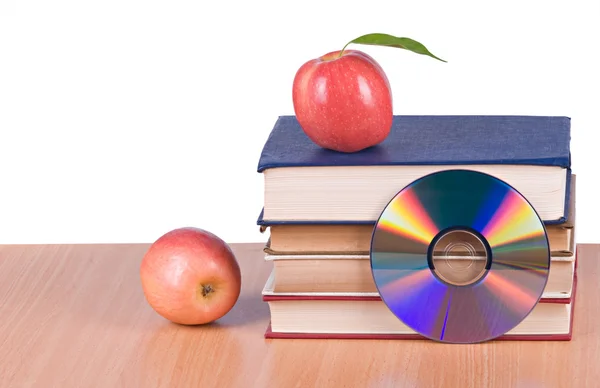Manzanas, dvd, y libros como símbolos de transición fron viejo a ne —  Fotos de Stock