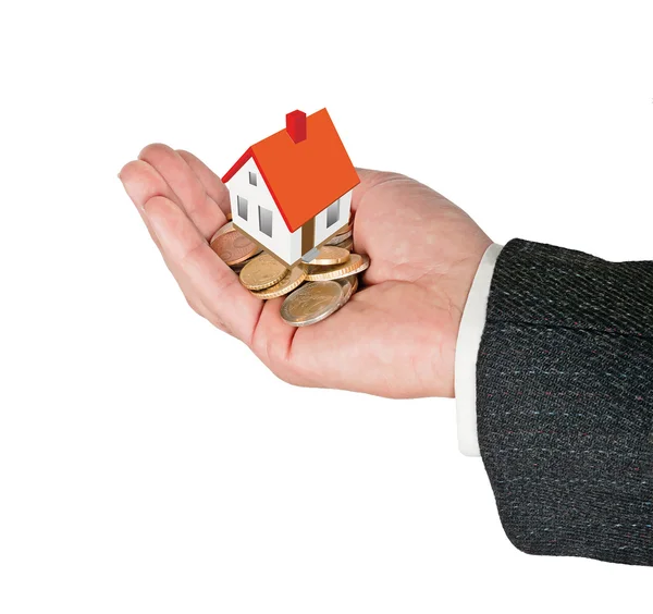 Hand with gift of money and house — Stock Photo, Image