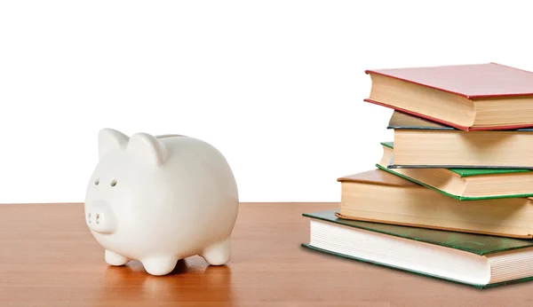 Piggy bank en boeken — Stockfoto