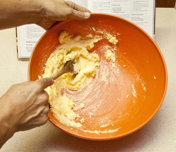 Mixing banana bread in orange bowl — Stock Photo, Image