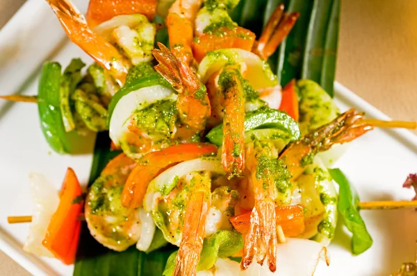 Shrimps and vegetables skewers Stock Picture