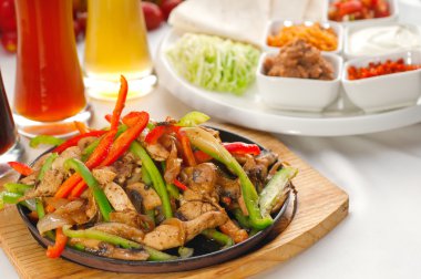 Original fajita sizzling hot on iron plate clipart