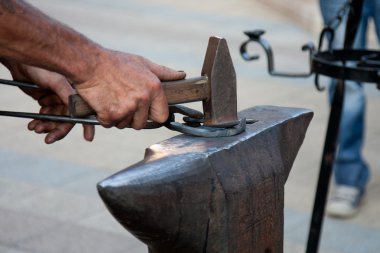 Blacksmith working clipart