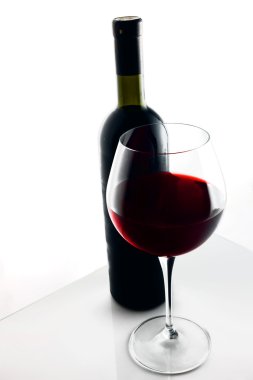 Glass and Bottle of red wine. clipart