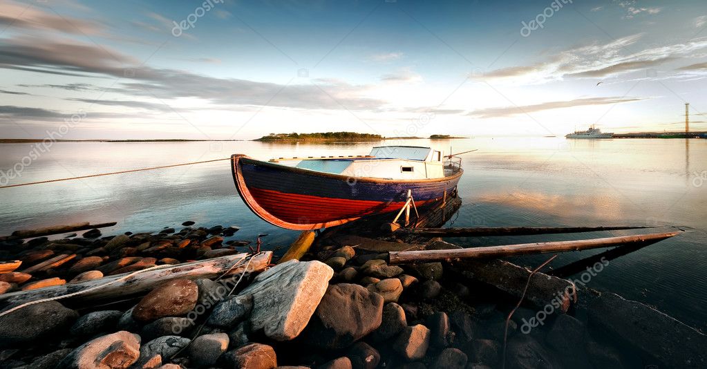 The boat on the shore.