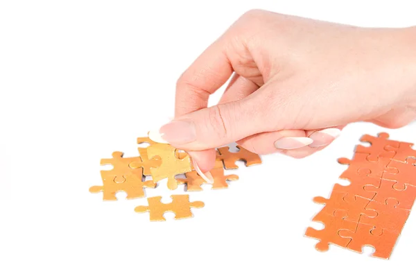 stock image Woman hand putting right puzzle