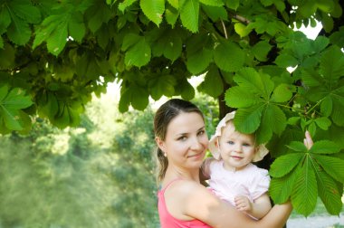 Woman and child hugging clipart