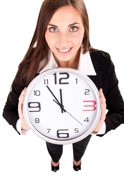 Businesswoman holding clock Royalty Free Stock Images