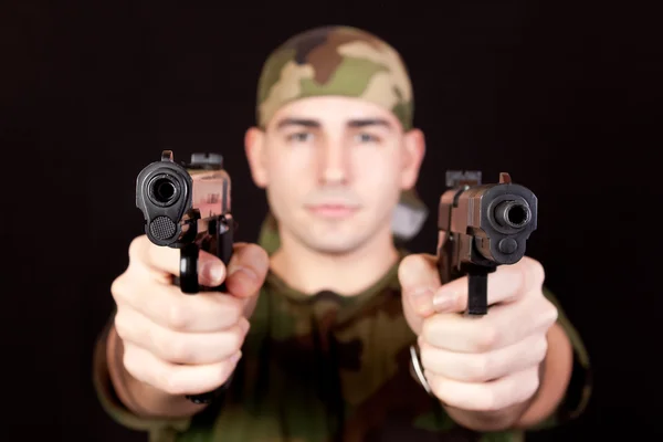 Soldier with two guns — Stock Photo, Image