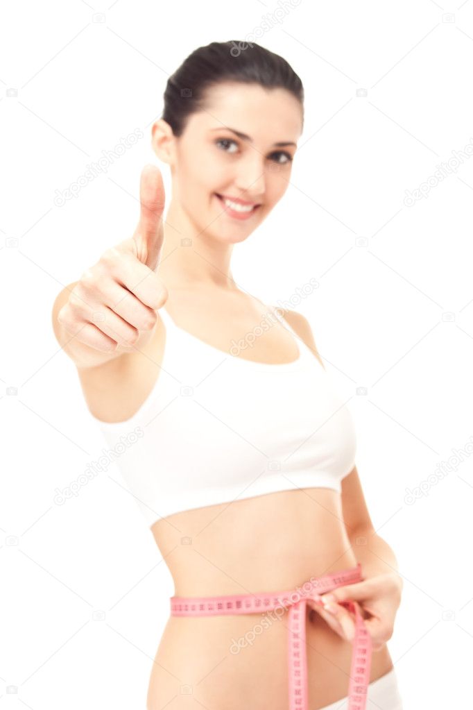 Healthy woman success measuring her waistline