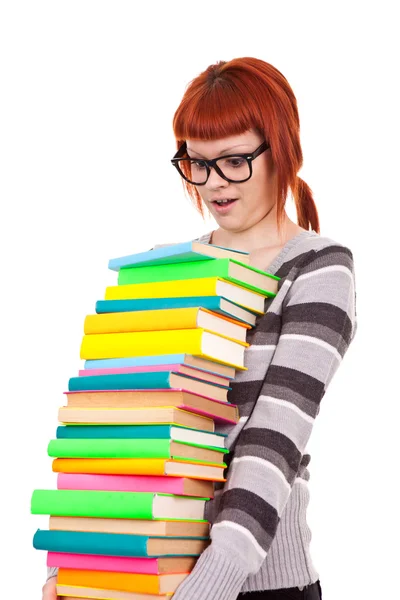 Divertida estudante com livros de pilha — Fotografia de Stock