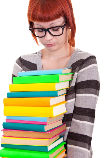Sad school girl with stack color books Stock Photo