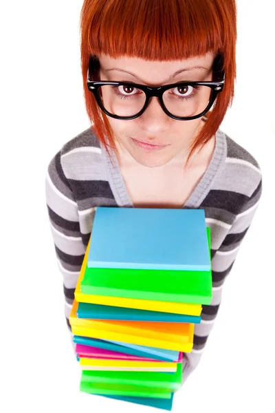 Školačka drží hromadu knih — Stock fotografie