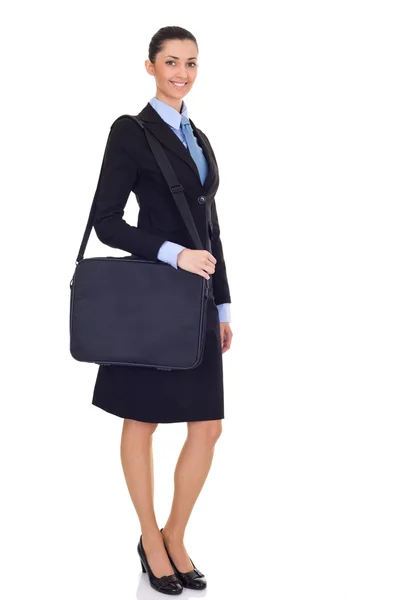 Mujer de negocios de pie con un maletín y sonriendo —  Fotos de Stock