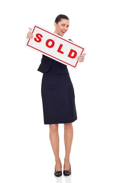 Affärskvinna med försäljning tecken — Stockfoto