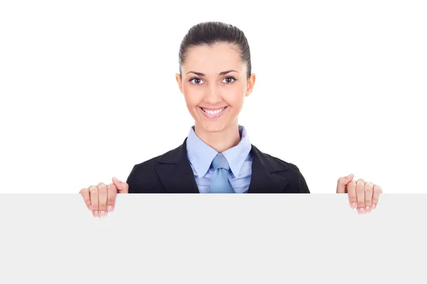 Smiling businesswoman holding blank sing — Stock Photo, Image