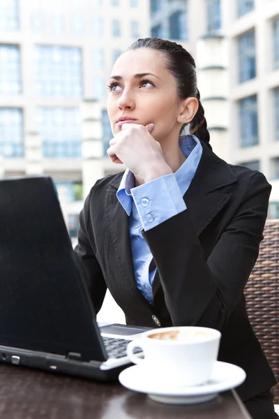 Young business woman thinking — Stock Photo, Image