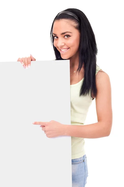 Adolescente apuntando a un tablero en blanco — Foto de Stock