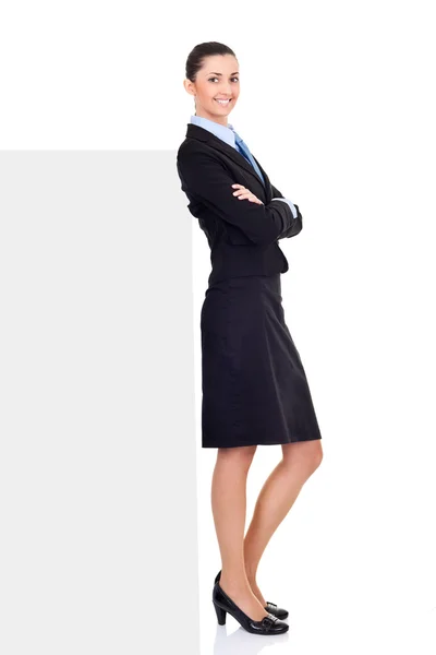 Businesswoman standing front of billboard — Stock Photo, Image