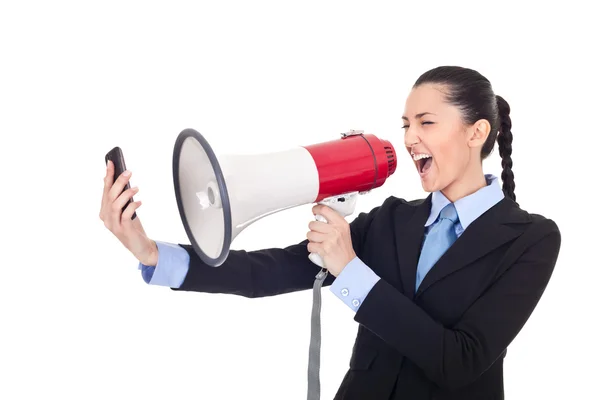 Бизнесвумен кричит по телефону через мегафон — стоковое фото