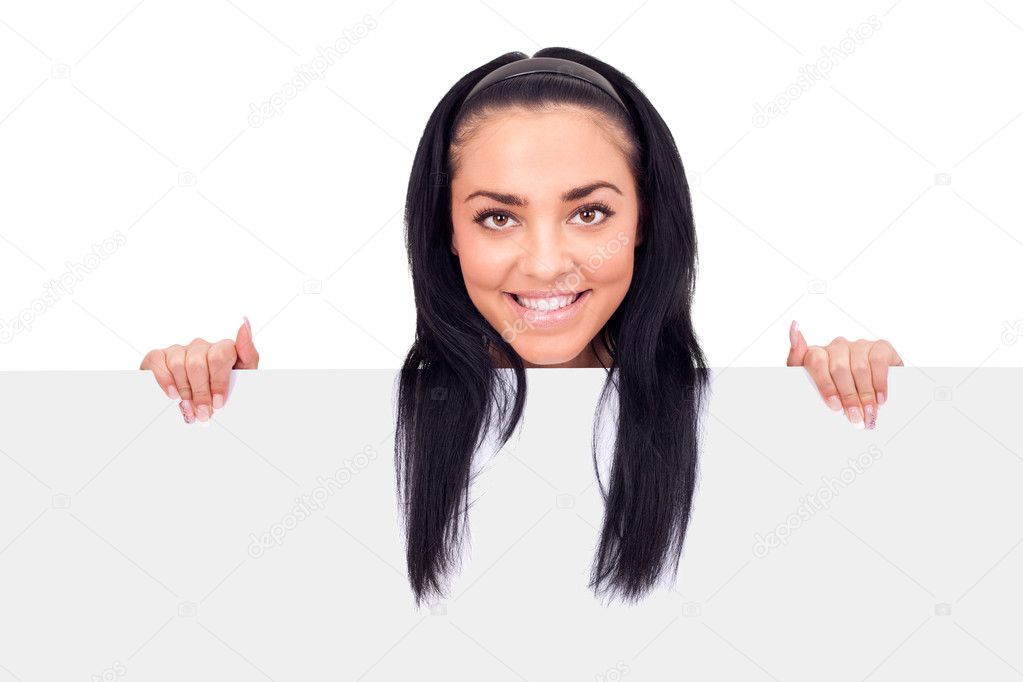 Teen girl holding blank billboard