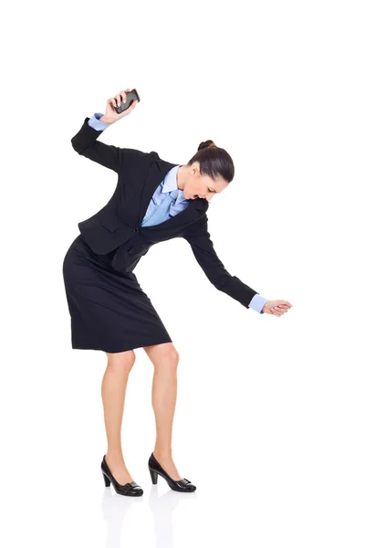 Businesswoman smashing her phone — Stock Photo, Image