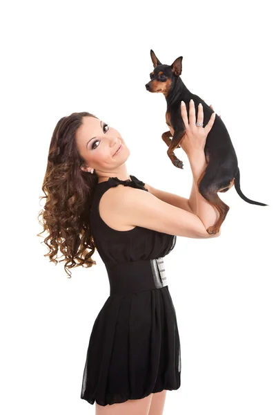 Young woman and sweet puppy playing — Stock Photo, Image